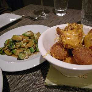 Roasted brussels sprouts & apples; spiced hush puppies with 7 yr cheddar
